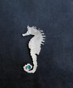 Silver seahorse and opal brooch