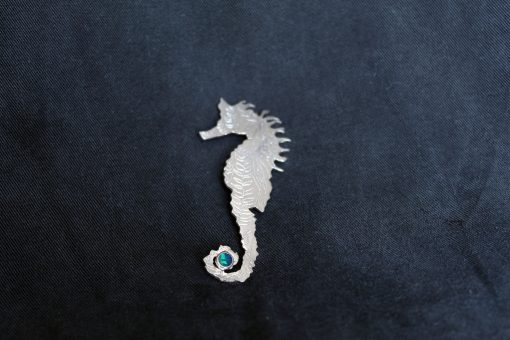 Silver seahorse and opal brooch